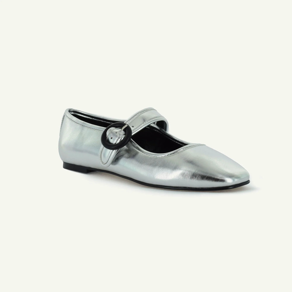 Silver Mary Jane flat with buckle strap and black interior lining