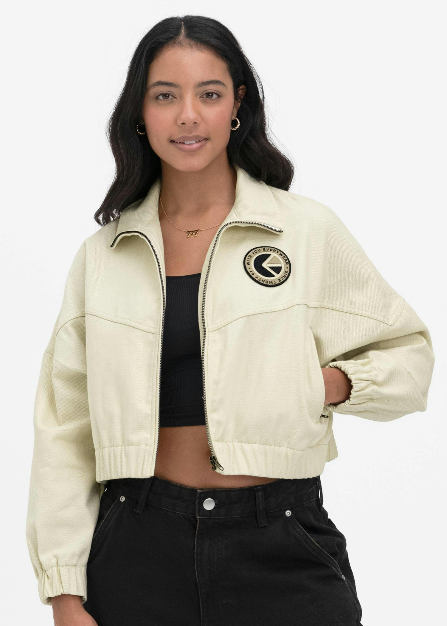 Beige vintage women's jacket with front zip and chest logo patch