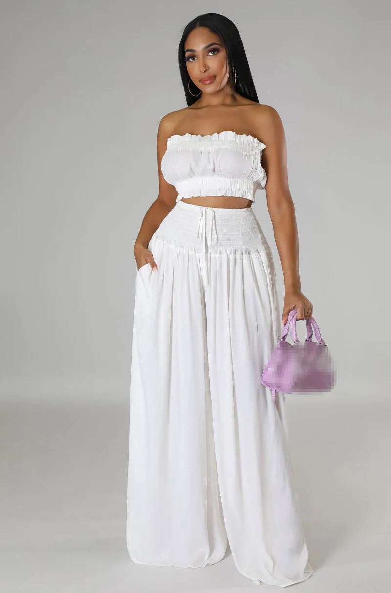 White women’s 2-piece set: smocked strapless bandeau top and gathered maxi wide-leg pants