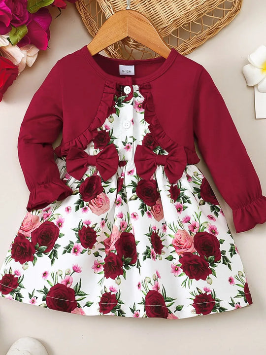 Lady Ros deep red dress with floral white skirt, frill sleeves and bow front detail
