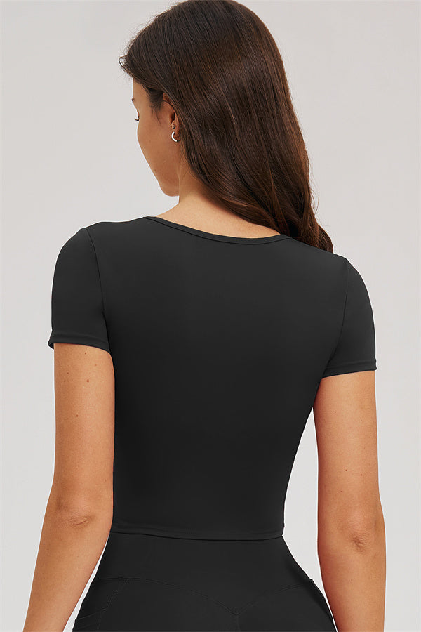 Black T-shirt and leggings set, back view with contoured waist seam