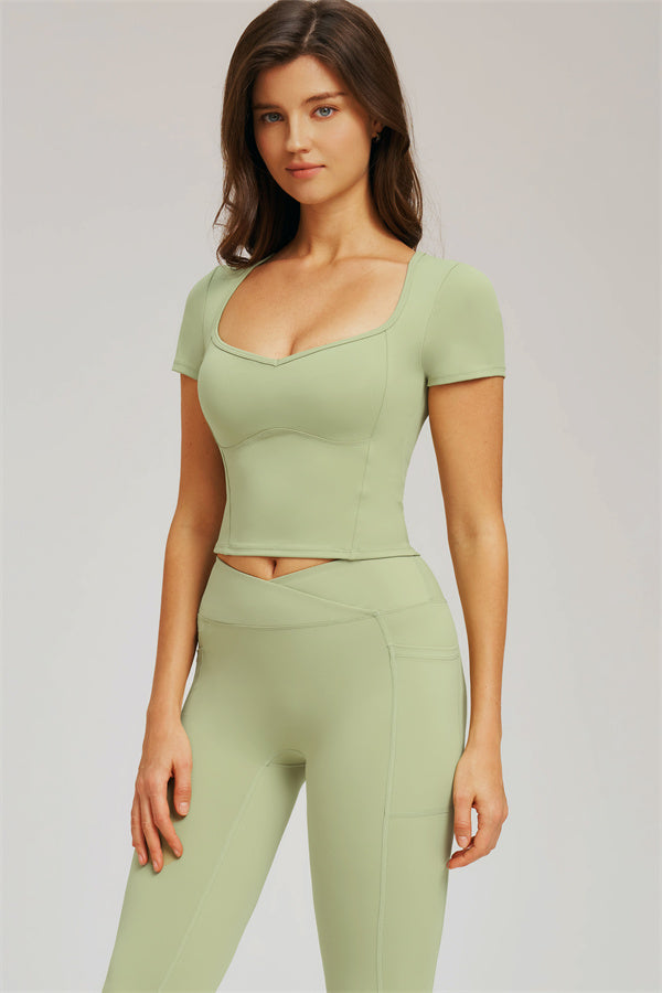 Front view of light olive green cropped T-shirt with seamless-style leggings set