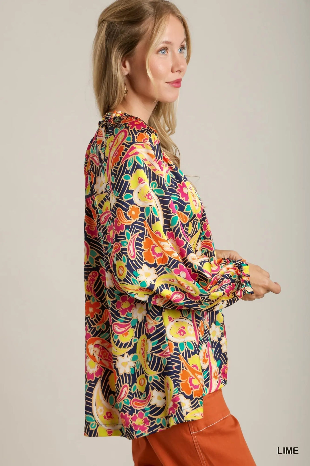 Side view: multicolor paisley satin blouse with gathered ruffle collar and long sleeves