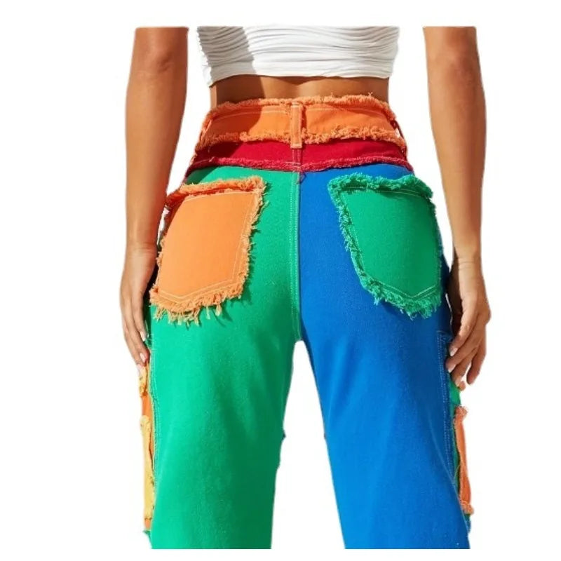 Close view of back panel patchwork denim jeans; multicolor blocks with frayed edges