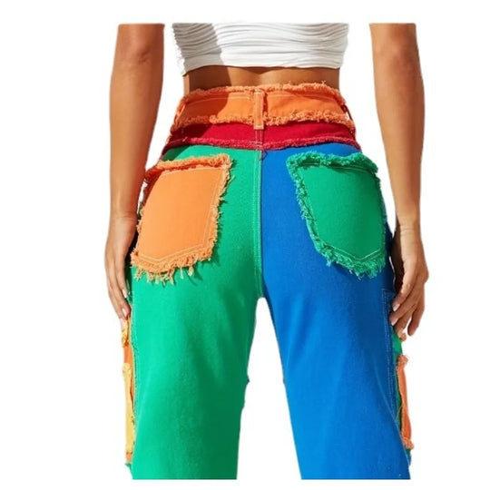 Close view of back panel patchwork denim jeans; multicolor blocks with frayed edges