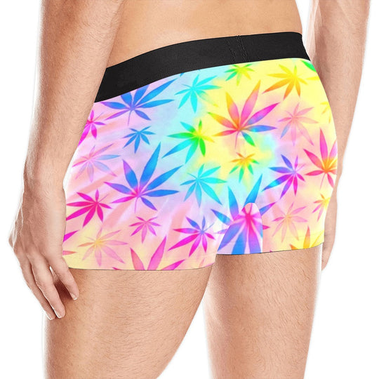 Back view of rainbow weed tie-dye boxer briefs, black waistband and leaf print.