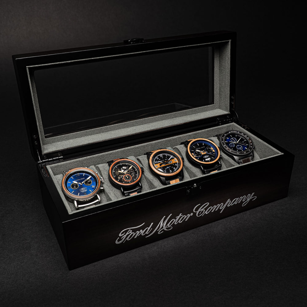 Ebony watch holder with lid open; 5 watches displayed in slots