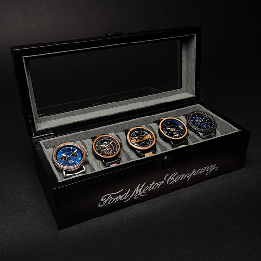 Ebony watch holder with lid open; 5 watches displayed in slots