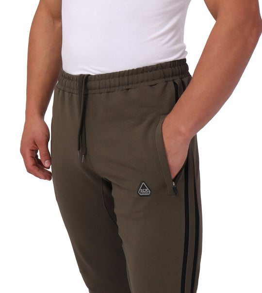 Jogger sweatpants (tall) with elastic waist, olive fabric, black logo patch and drawstring