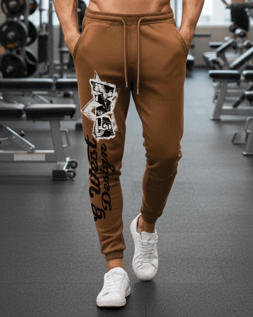 Brown jogger pants with graphic print, drawstring waist, ribbed cuffs