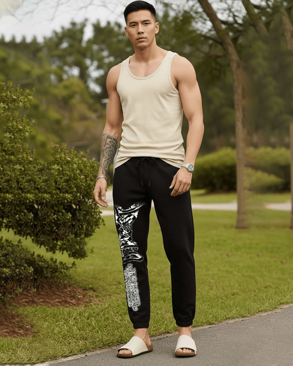 Black jogger with white graphic panel on the side, elastic cuffs, and drawstring waist