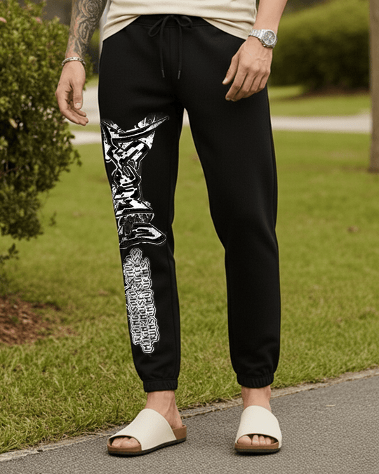 Black jogger with white side graphic print, drawstring waist, and ankle cuffs
