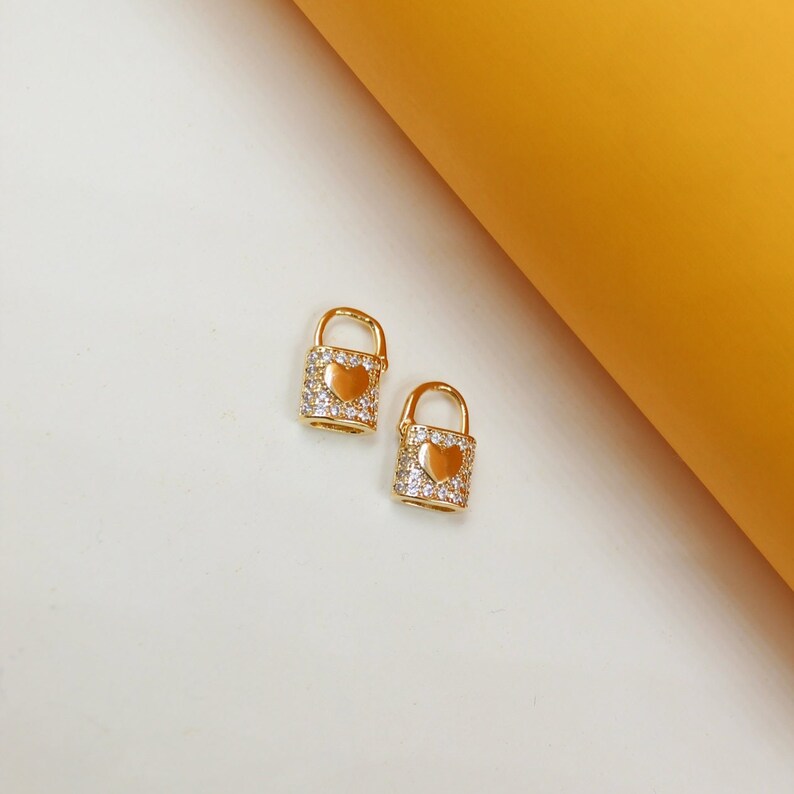 Lock heart huggie studs, gold-tone with sparkling pavé and heart center