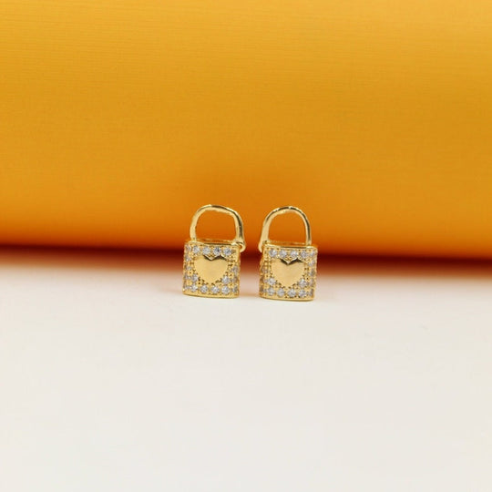 Lock heart huggie earrings, gold-tone with clear pavé and heart cutout