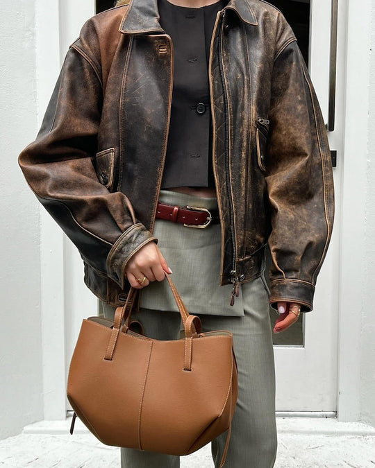 Oversized distressed brown leather jacket, zip-front and stand collar, front view