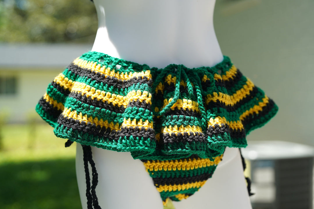 Close-up of crochet micro mini skirt with drawstring ties, green yellow stripes