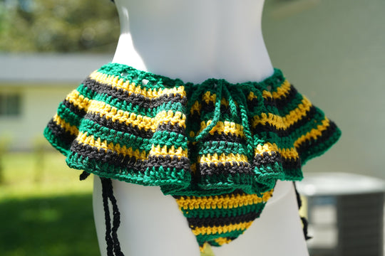 Close-up of crochet micro mini skirt with drawstring ties, green yellow stripes