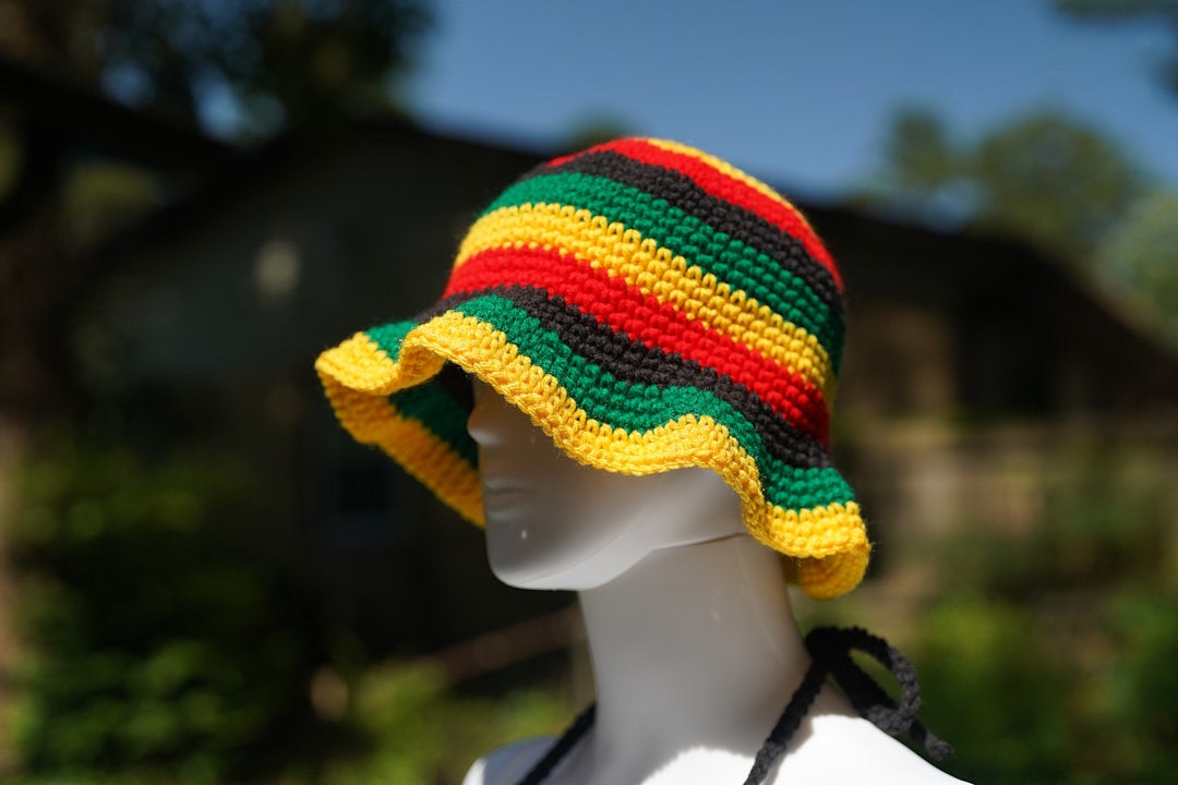 Rasta striped crochet bucket hat with scalloped brim and black bikini top ties