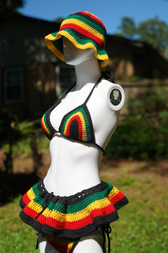Rasta crochet bucket hat and triangle bikini top with rainbow-striped micro mini skirt