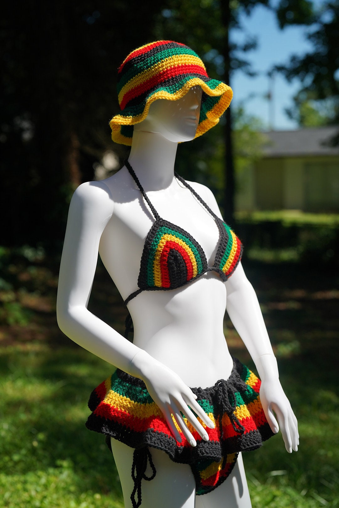 Rasta crochet bucket hat set: triangle bikini top and micro mini skirt on a mannequin