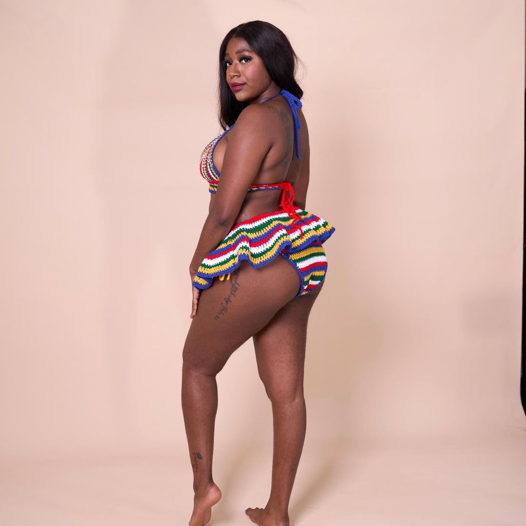 Side view of multicolor striped crochet bikini with micro mini skirt cover-up