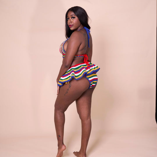 Side view of multicolor striped crochet bikini with micro mini skirt cover-up