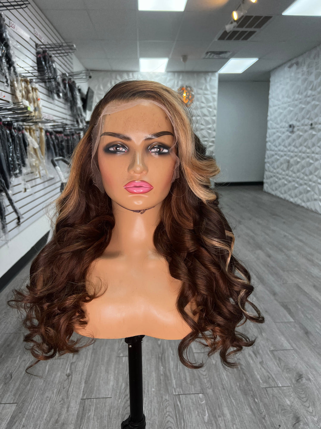 BRI WAVY UNIT wig, long dark-brown wavy hair with subtle blonde highlights near crown