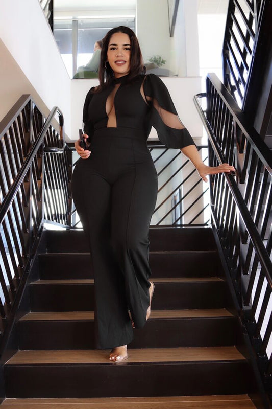 Black long jumpsuit with sheer mesh shoulder cutouts and flared leg