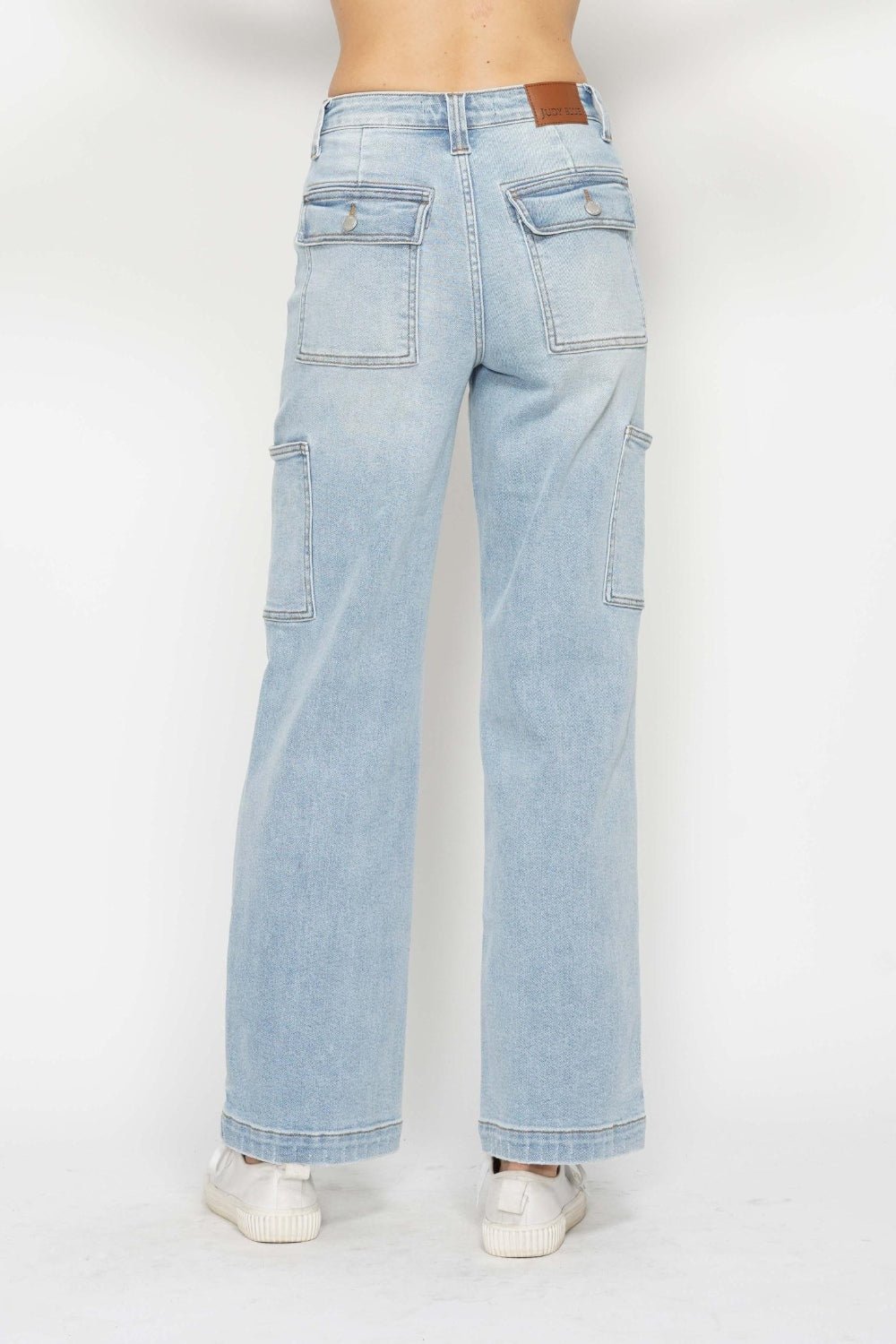 Light wash high-waist straight cargo jeans with two front cargo pockets and belt loops