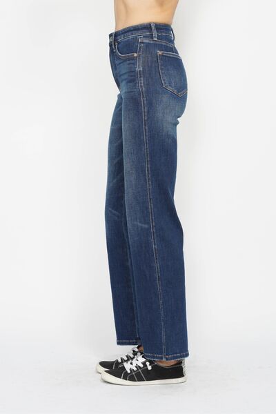 Side view of dark high-waist jeans with straight leg and visible seam details
