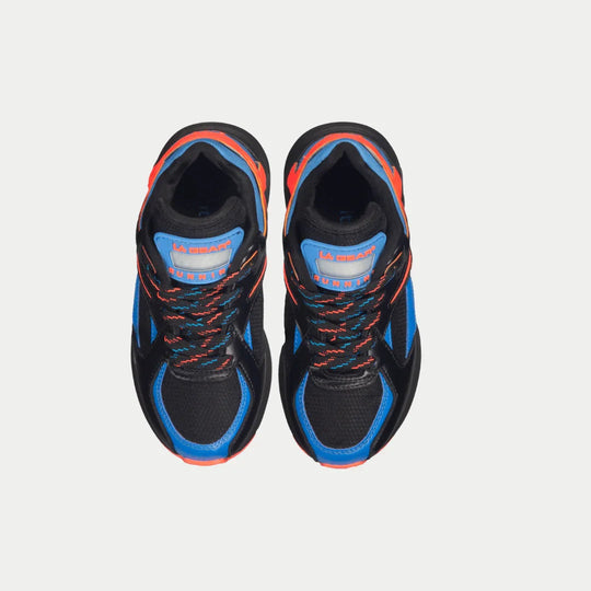 Pair of kids sneakers—black uppers with blue inner panels, orange trim, and lace-up closure