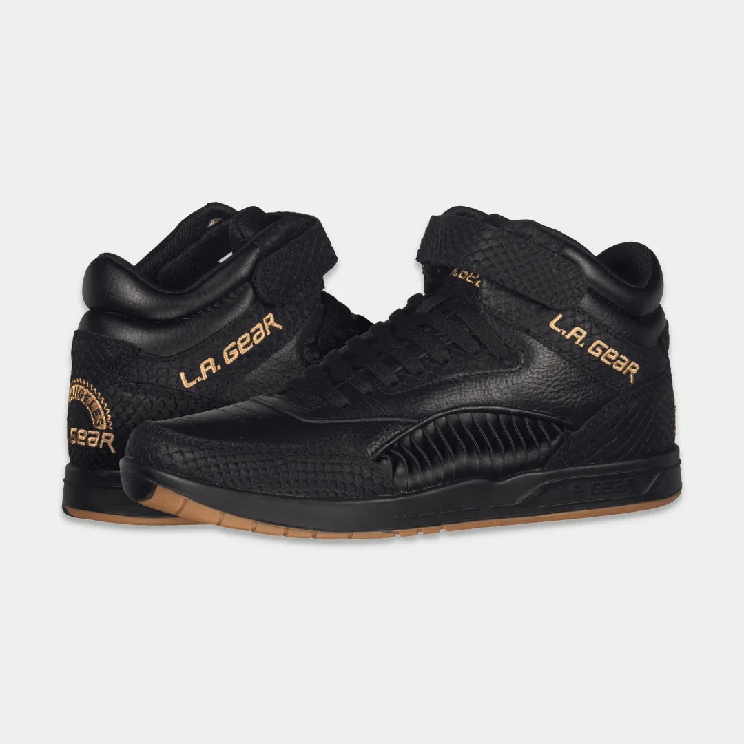 Black high-top sneakers with LA Gear logo, textured panels, and gum outsole