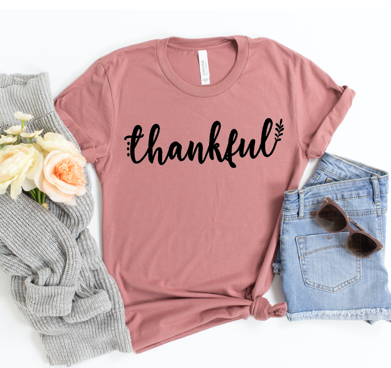 Thankful T-shirt in dusty rose with black “thankful” script and leaf accents