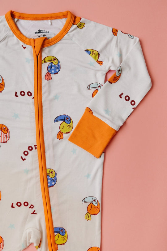 White baby romper with orange zip and loop bird print, long sleeves