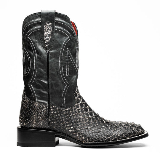 Black western boot with high shaft, V-shaped stitched panels, and red inner lining