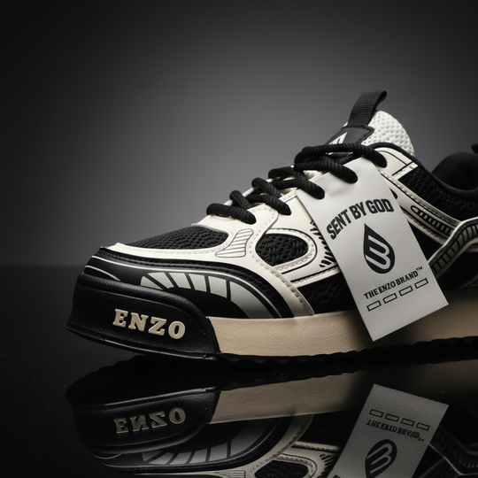 Close-up of milk-white and black lace-up sneakers with graphic overlays and tongue tag