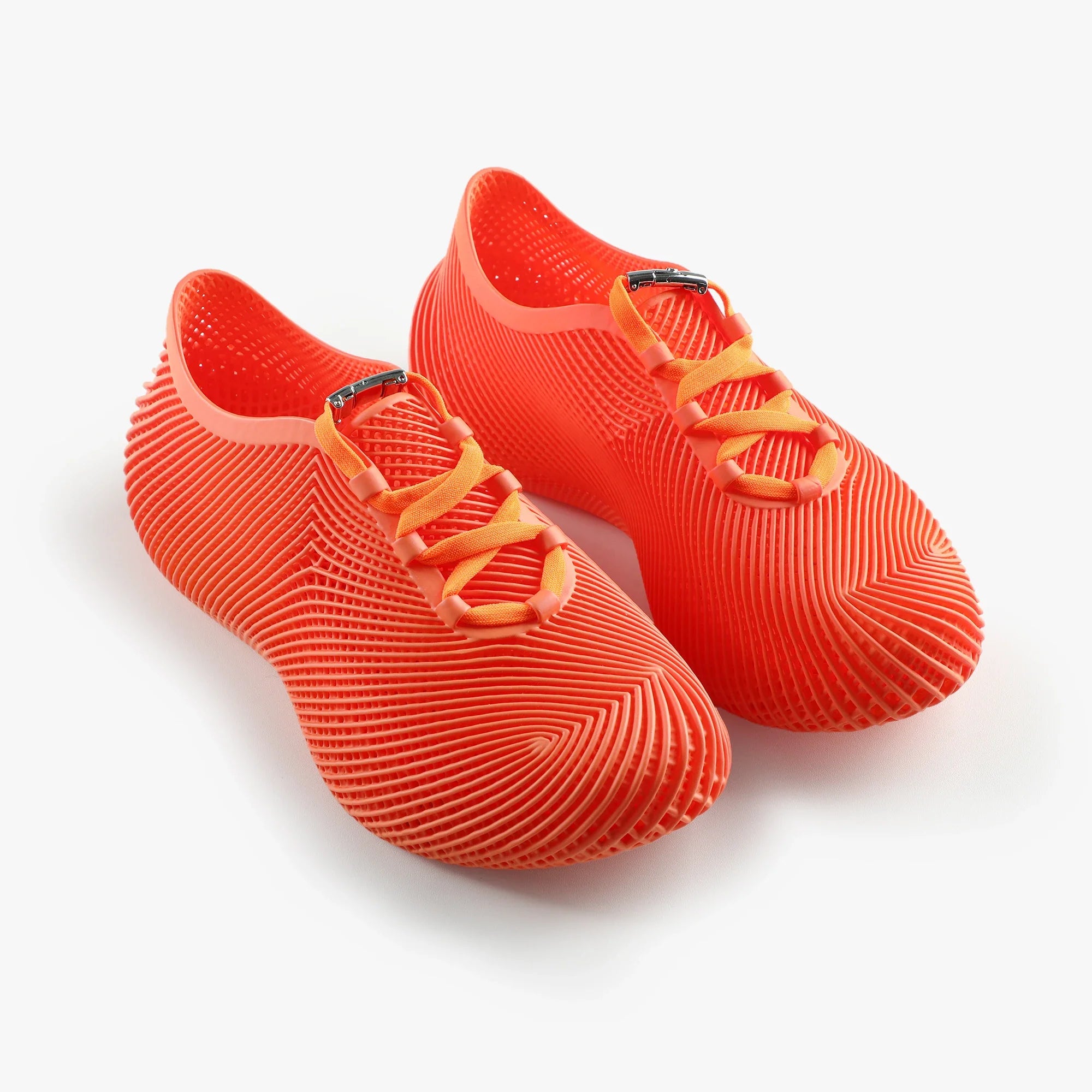 Orange 3D printed sneakers with lace-up straps and ribbed lattice upper