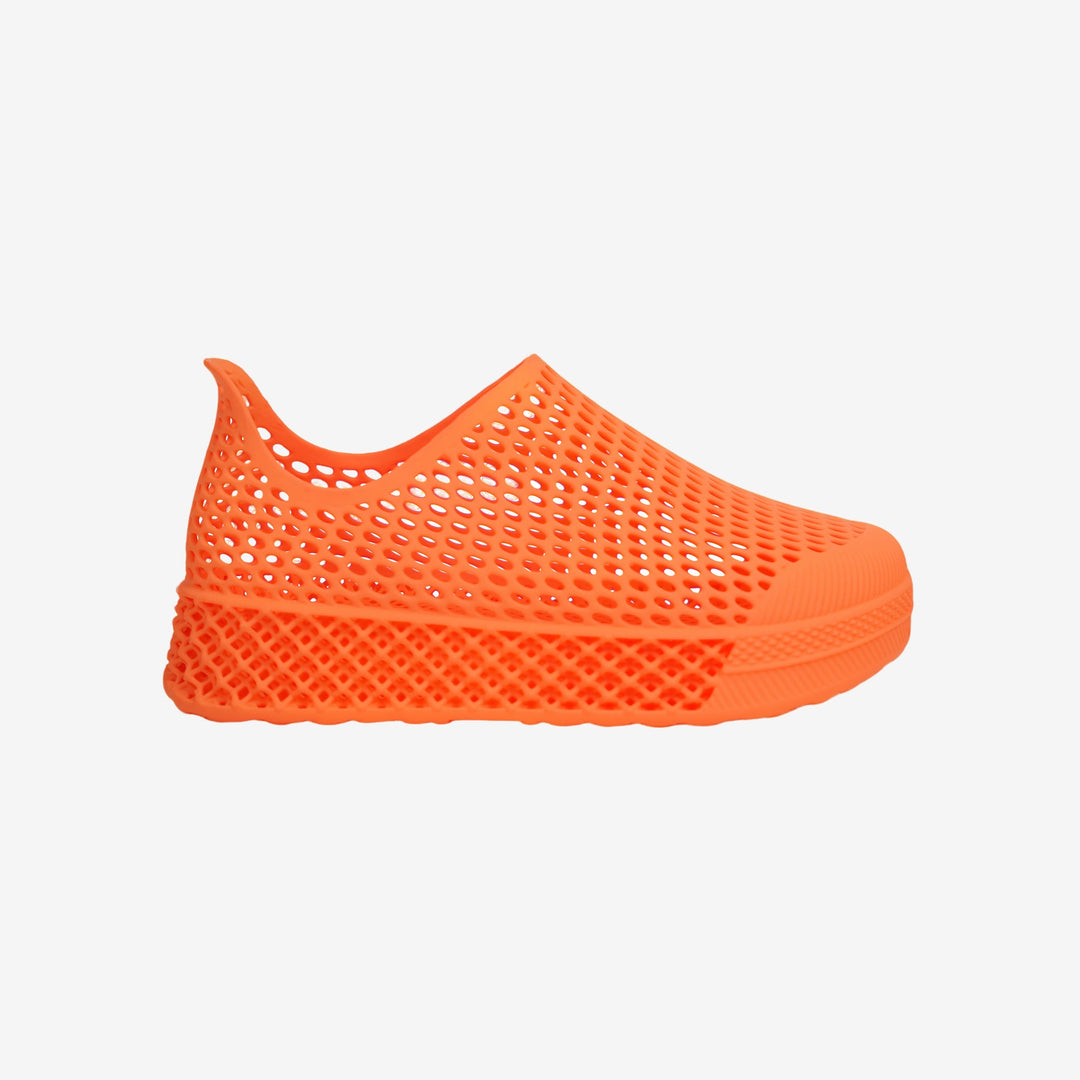 Orange 3D printed kids slip-on shoe with perforated mesh upper and cushioned sole