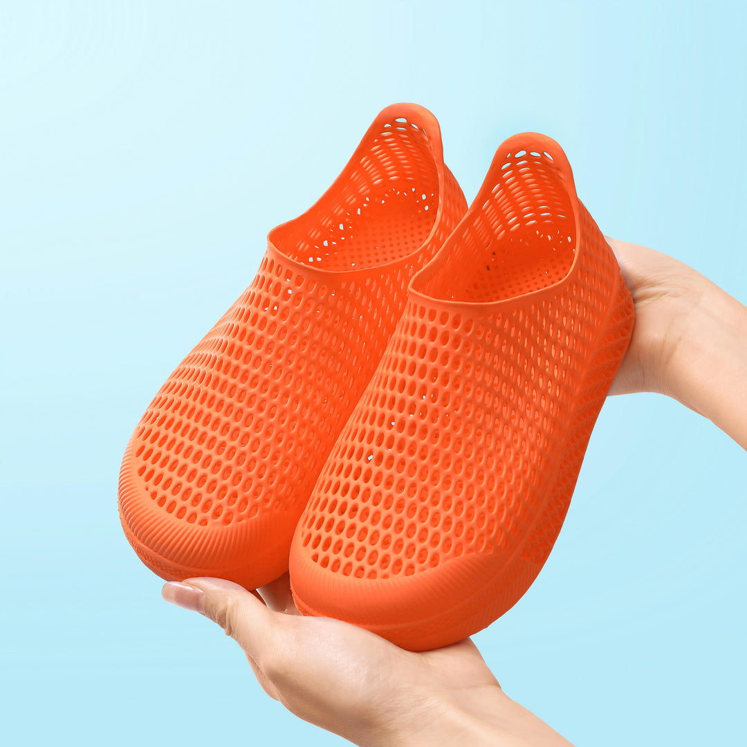 Orange 3D-printed kids slip-on shoe with textured breathable upper