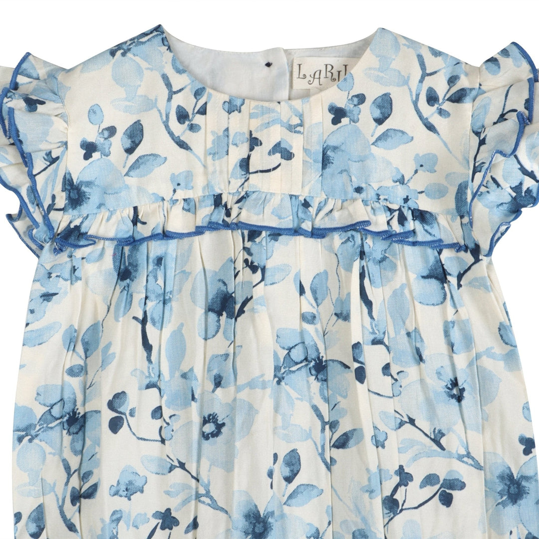 Periwinkle blue floral romper neckline and gathered chest with ruffled trim