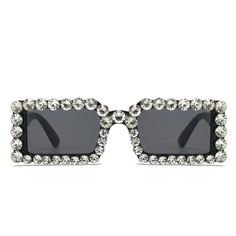 Pair of rhinestone-trim square sunglasses with bright black frame and dark lenses