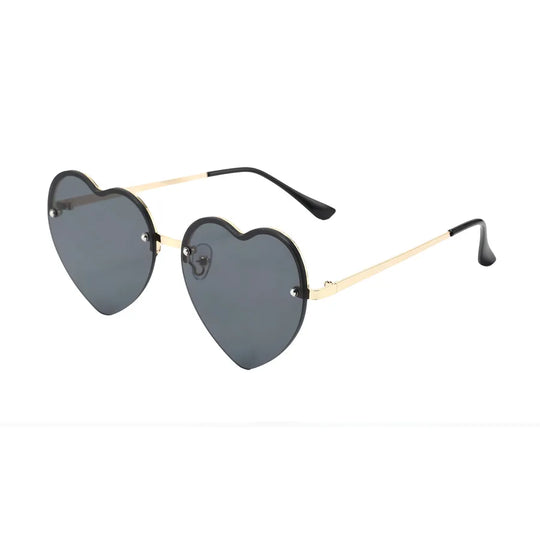 Heart-shaped half-rim sunglasses, side view, darker gray lenses with gold arms