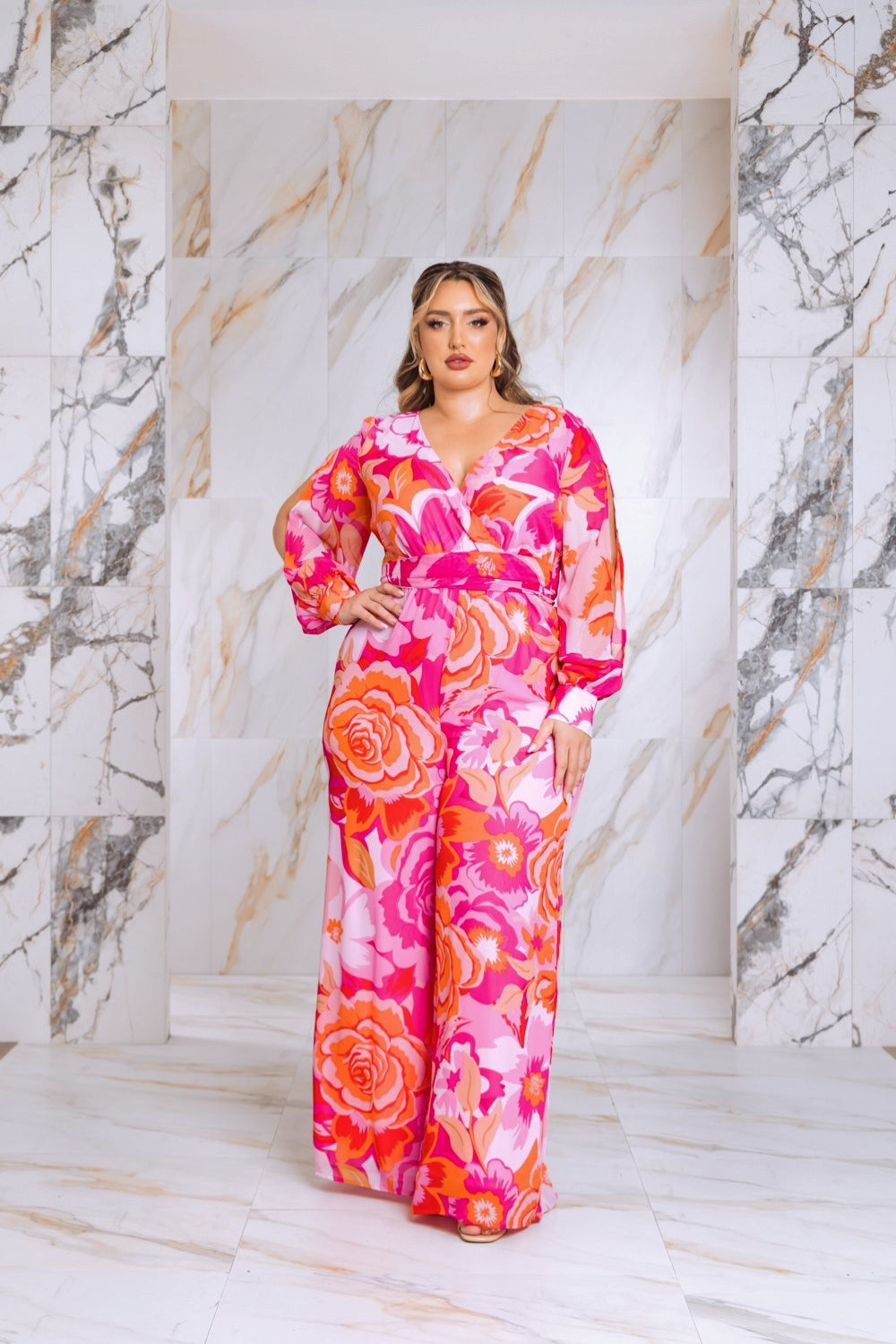 Pink floral plus-size jumpsuit with long bishop sleeves and split cuffs
