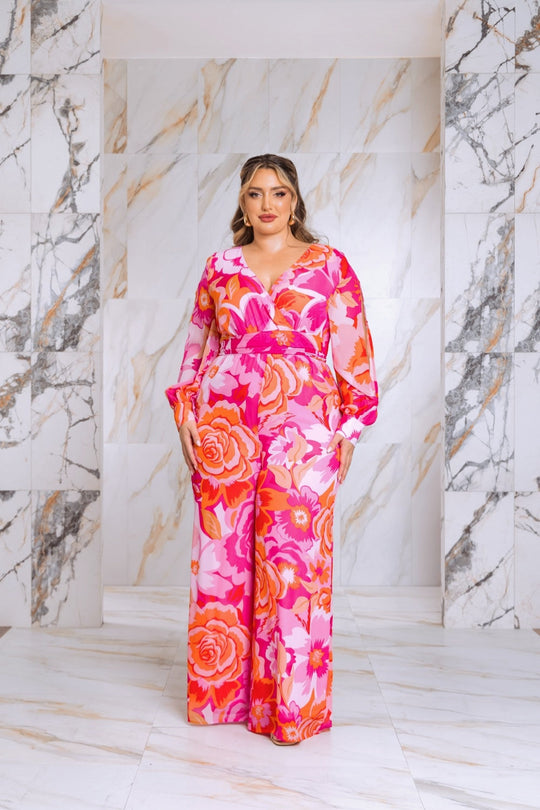 Pink floral jumpsuit with long bishop sleeves and belted waist, full front