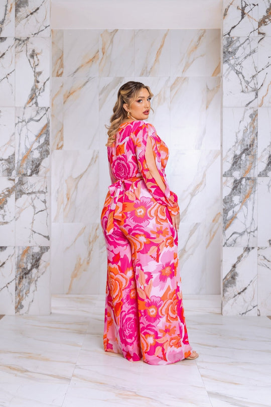 Pink floral jumpsuit, belted waist, long split sleeves, side view