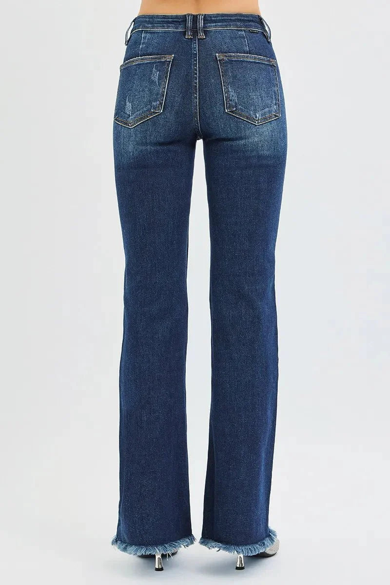 Back view dark wash flare jeans with two back pockets, belt loops, frayed hem