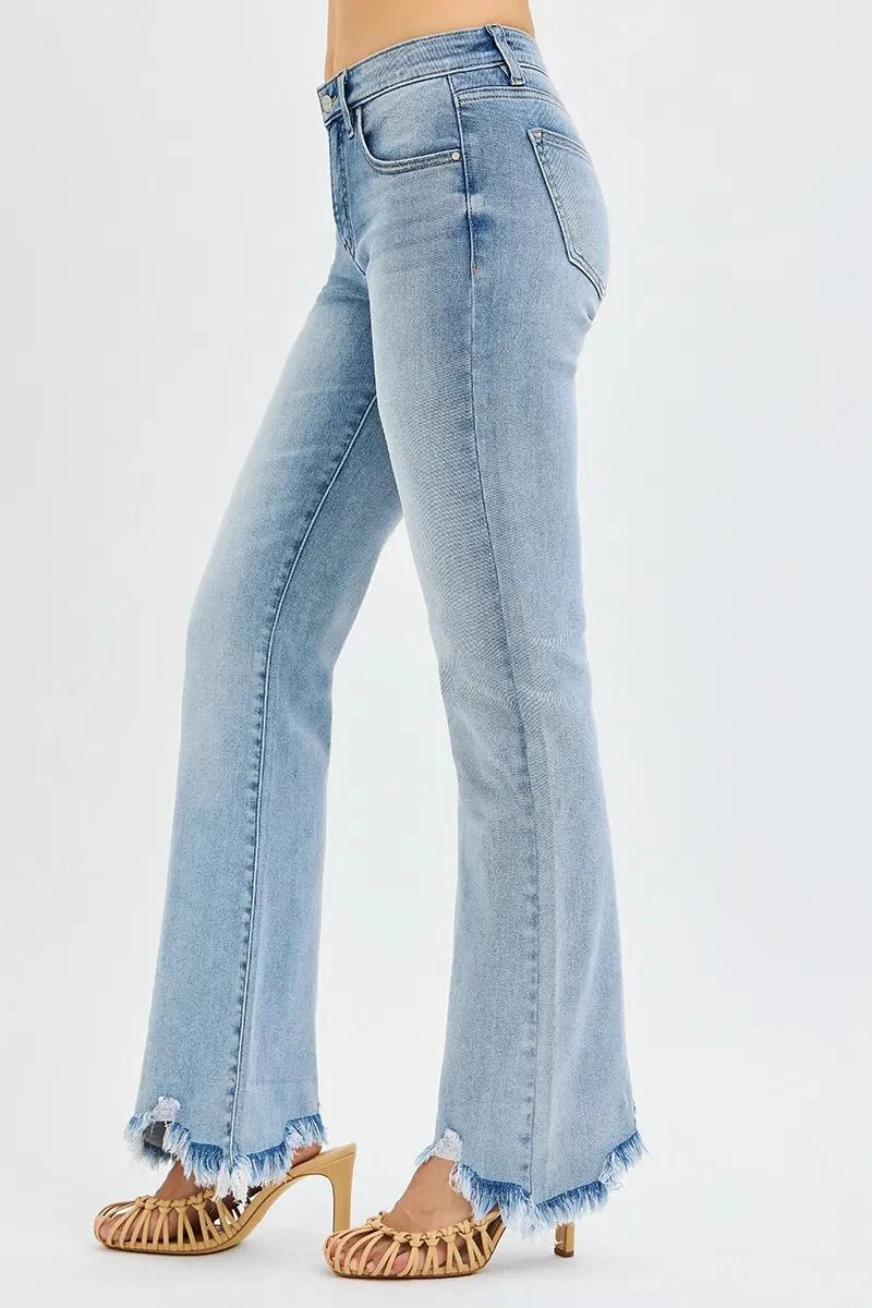 Medium wash flared jeans side view with contrast stitching and frayed hem