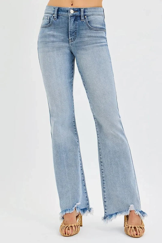 Medium wash flare jeans back view with belt loops and frayed hem