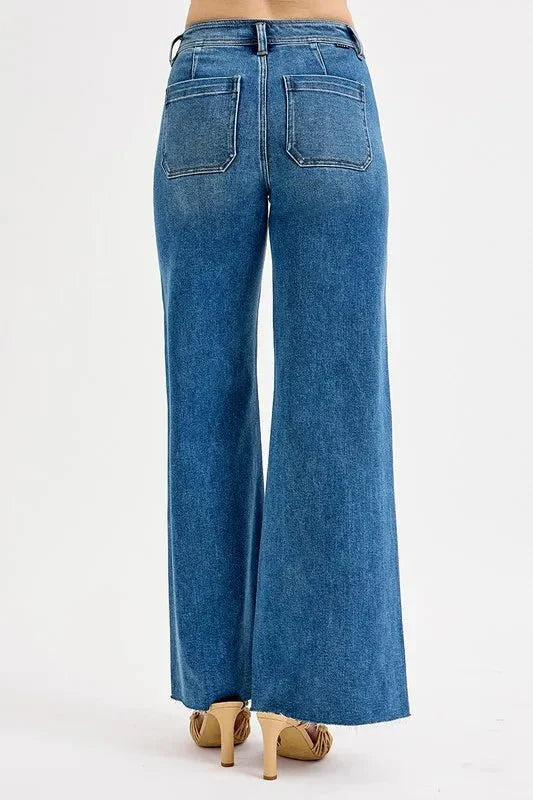 Rear view: medium wash wide-leg jeans with two back patch pockets