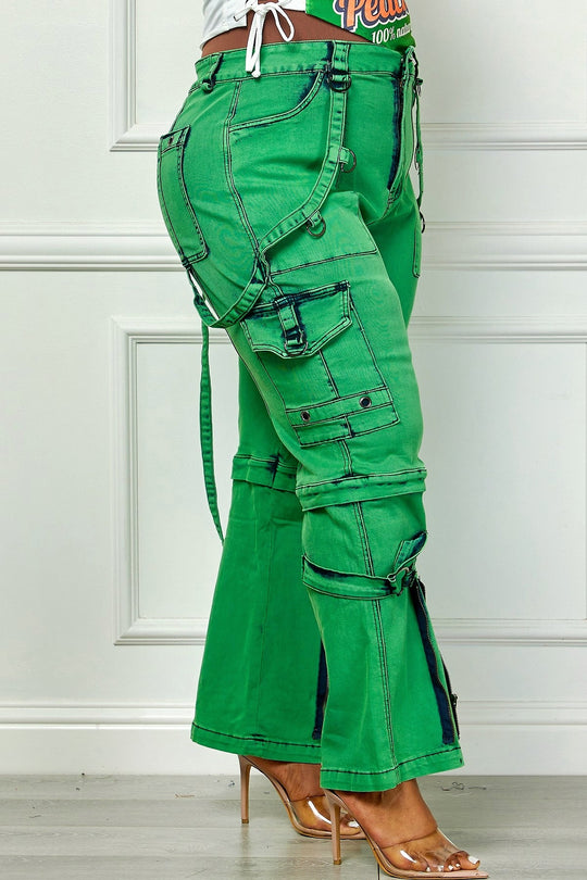 Green utility cargo denim pants, side view with dangling belt straps and leg pockets